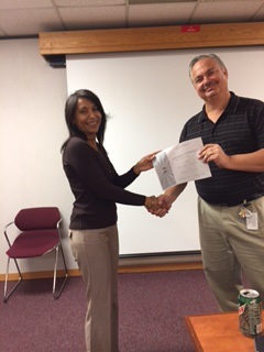 Melany Decker receives her 2nd place Evaluation Contest certificate